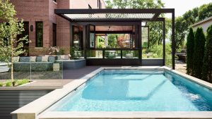 This $7.7 M Traditional Chicago Home Made of Limestone and Brick Hides a Striking Sun Parlor