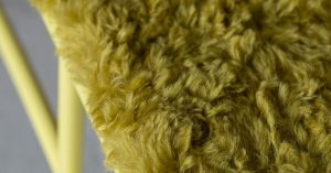 plush long-pile fabric covers tubular yellow steel bench observation.01